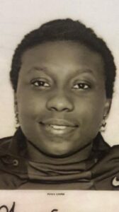 Headshot of Jhiya Cooper, a young, Black woman, smiling for the camera